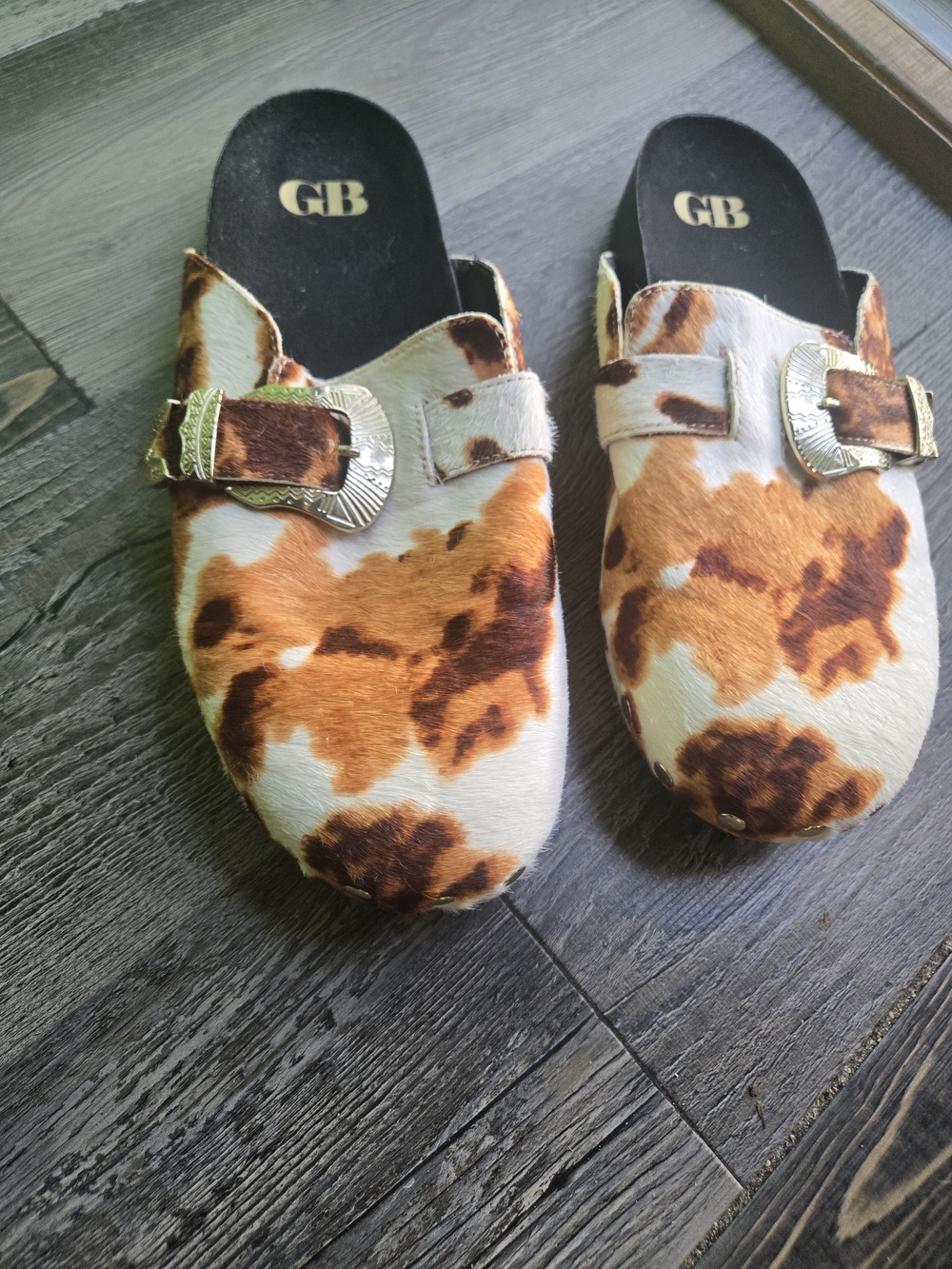 Gianni Bini  Cow-Print Slip-On Mules in Brown & White with Gold Buckles